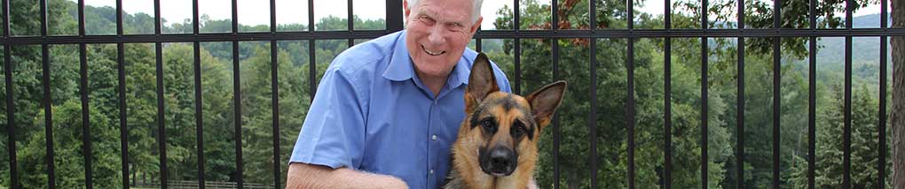 Visually impaired person with his German Shepard seeing eye dog